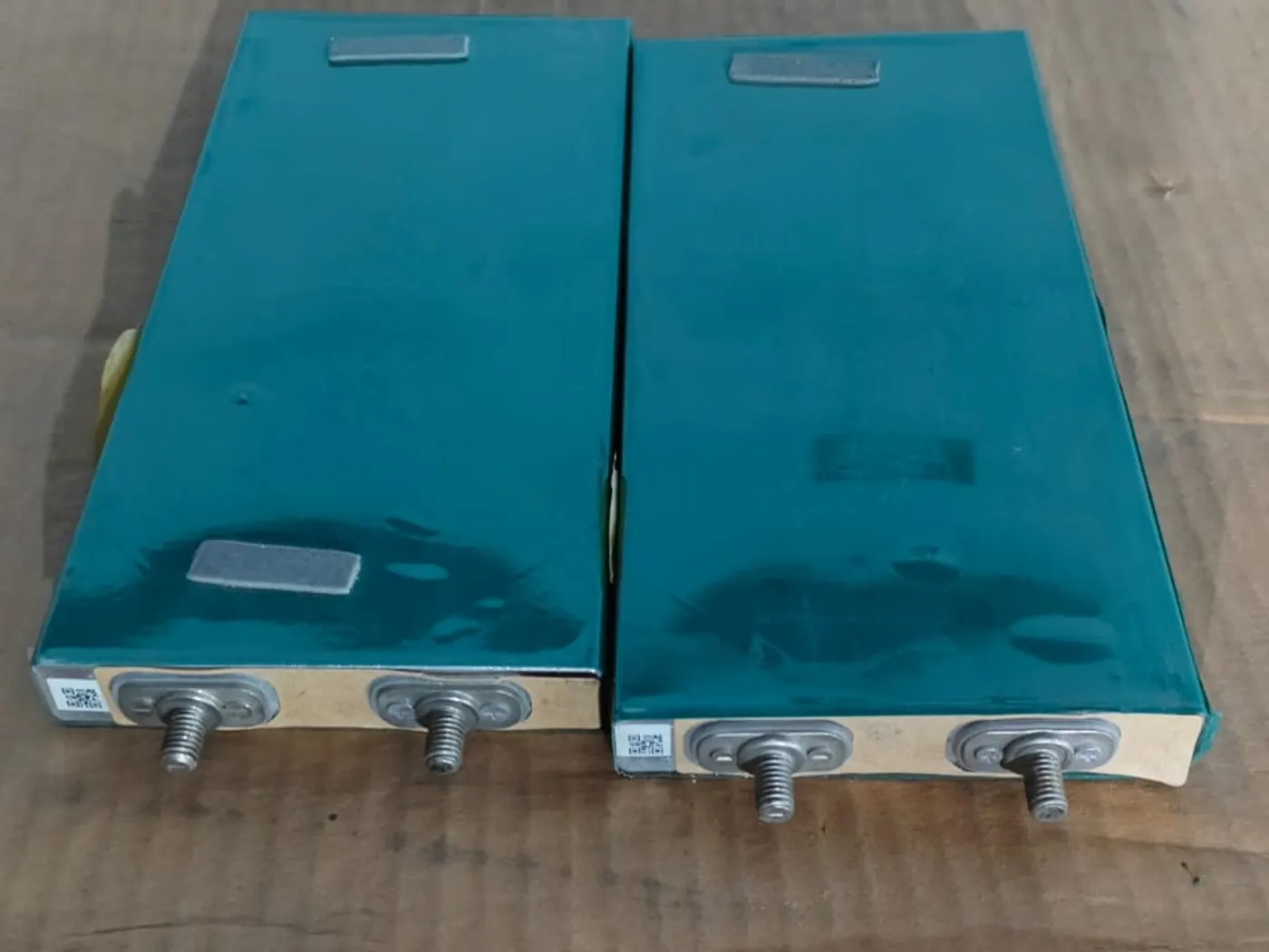 Two large prismatic battery cells with terminals