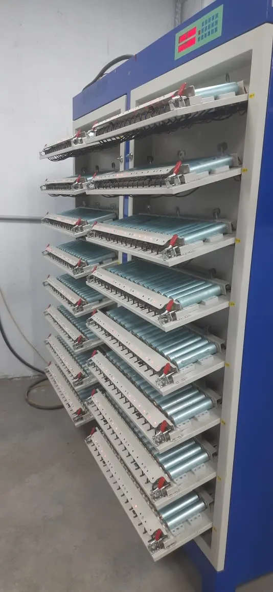 A testing cabinet with every shelf loaded with cells
